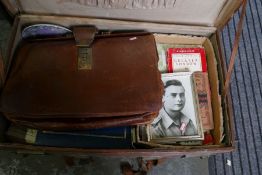 An old tan leather suitcase, ephemera and sundry