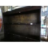 Period oak dresser with open rack above drawers and cupboards