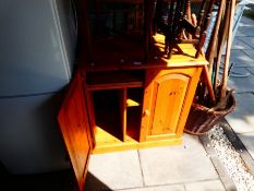 Waxed pine two door storage cupboard with pull out desk