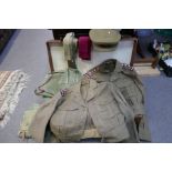 An old tan leather suitcase containing old military uniform belonging to RAMC Captain