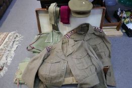 An old tan leather suitcase containing old military uniform belonging to RAMC Captain