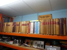 A shelf of leather-bound London-based Pharmacy prescription ledgers, including prescriptions for som