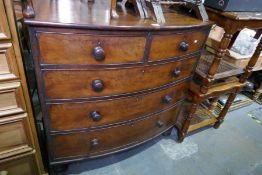 An antique mahogany bow front chest having two short and three long drawers