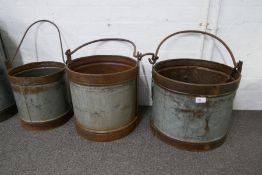 Three milk buckets