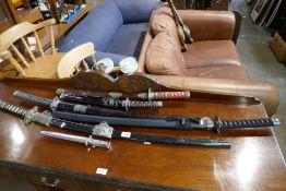 Five reproduction Samurai swords and a dagger