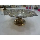 A silver Victorian fruit bowl on a raised pedestal foot with a repoussed and pierced decoration. Hal