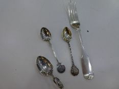 Silver flatware to include three silver soons and a large heavy Victorian silver fork. Fork hallmark