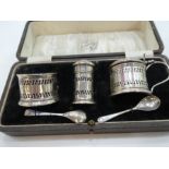 A silver cruet set of pierced design and Bristol blue inserts. Hallmarked Birmingham 1930, Docker &