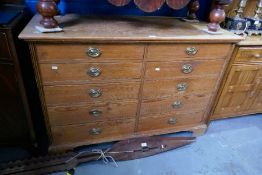 An old pine chest having ten drawers