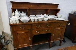 An Edwardian inlaid mahogany sideboard having four drawers with raised shelf back, 152cm