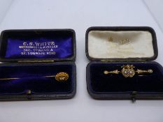 15ct stick pin with small diamond chip, in fitted case 'C.S.White' 342 Strand, 98 Edgware Road, toge