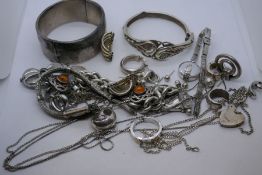 Box of silver and white metal costume jewellery to include amber earrings, bangle, etc