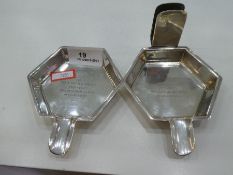 Two silver Hexagonal ash trays, one with a matchbox stand. With engraved message dated. Hallmarked B