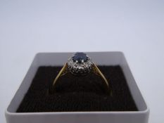 18ct, Platinum cluster ring with central pale sapphire surrounded diamond chips, size O, 3.1g marked