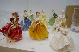 Seven Royal Doulton figures and one similar Coalport example