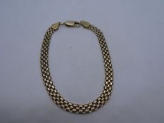 9ct yellow gold intricate design bracelet, 19cm,marked 375, link to clasp twisted, needs replacing.