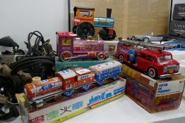 A selection of tinplate toys including Fire Engine etc, with boxes, stamped Made in China
