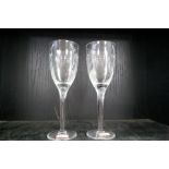 A pair of Lalique wine glasses decorated winged angel