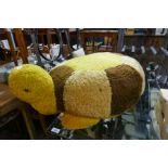 A vintage plush turtle footstool