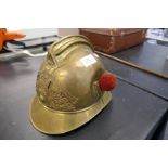 An early 20th Century french brass fireman's helmet