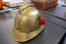 An early 20th Century french brass fireman's helmet