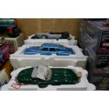 A selection of 1:24 scale Frankllin Mint precision model cars, including an E-Type