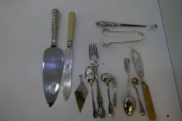 A selection of silver and white metal items to include flatware, pencil holder, button hook, silver