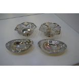 A pair of high quality, decorative silver bon bon dishes of pierced design on a raised pedestal foot