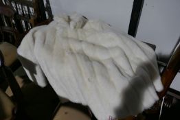 A fur coat and a faux fur white coat