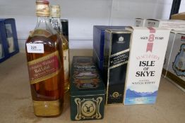 An old bottle of Johnny Walker Red label Whisky, two boxes of Whyte & Mackay commemorative Whisky an