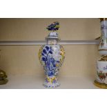 An old French Quimper style vase with cover, decorated figures and bird 43cm
