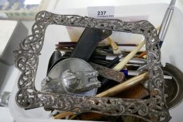 A Victorian silver photo frame, pens and sundry