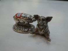 A silver novelty pig sitting down, a nice heavy and high quality item hallmarked London 2000 possibl