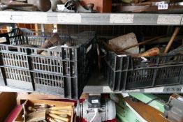 Two crates of old tools including chisels, axe heads and wooden handled tools etc