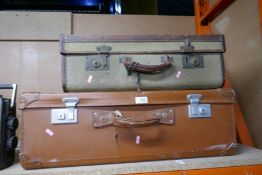 Two vintage suitcases one being canvas and leather bound