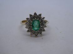 Pretty 9ct yellow gold emerald and diamond oval cluster ring, with central oval emerald, approx. 0.6