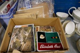 Two boxes of various vintage postcards and a box of loose stamps