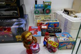 A selection of tin plate toys boxed including train, monkey, etc, made in China