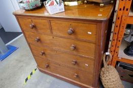 Solid wood two short over three long chest of drawers with turned wooden handles and a great patina