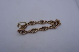9ct gold curb link bracelet set with multicoloured gemstones, 13.1g approx, marked 9ct