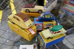 Four dinky, Corgi and Matchbox vehicles (some repro boxes)