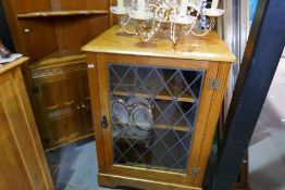 A reproduction oak standing corner cupboard and a similar Hi-fi cabinet