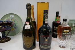 A bottle of vintage Dom Pérignon, 1976, and five other bottles of alcohol