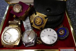 A small box containing Masonic medals, vintage wristwatches, coins, etc