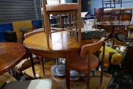 A vintage G Plan extending dining table and a set of four matching chairs