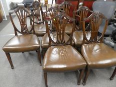 A set of eight reproduction Hepplewhite style mahogany dining chairs including a pair of carvers