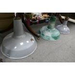 Three enameled industrial ceiling lights, one by Benjamin