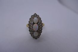 Antique yellow metal opal and diamond marquise design 18ct dress ring, with 3 central oval opa