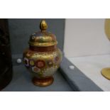 A Japanese Satsuma jar and cover having all over floral decoration, 14cm