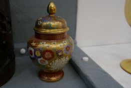 A Japanese Satsuma jar and cover having all over floral decoration, 14cm